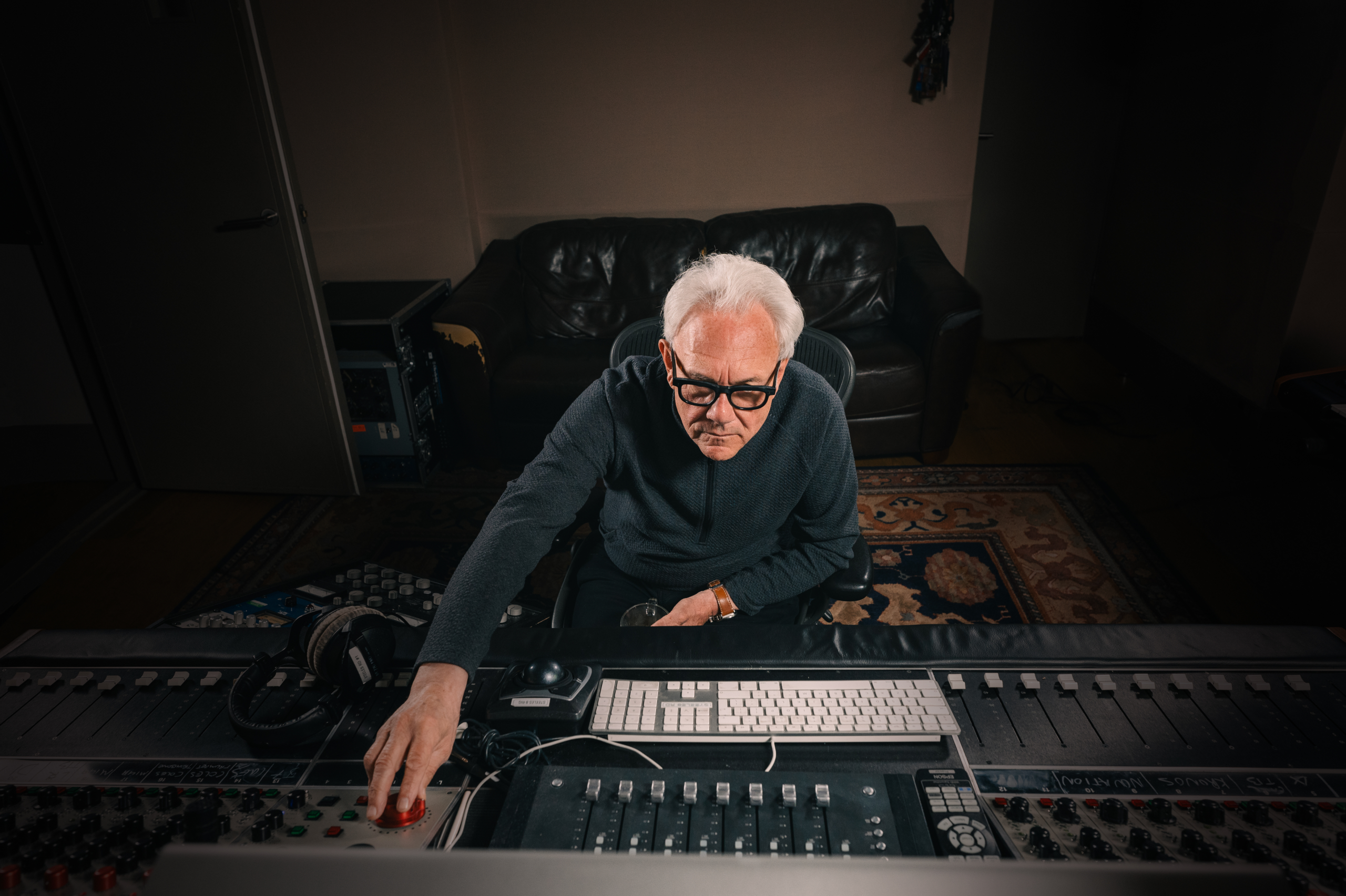 Trevor sat at the mixing desk