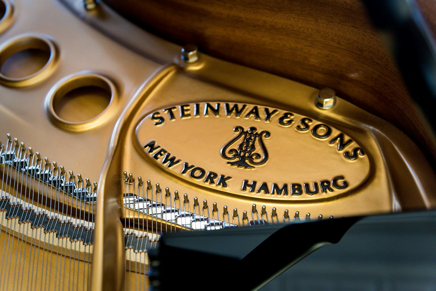 Close up of Steinway and Sons logo on the piano