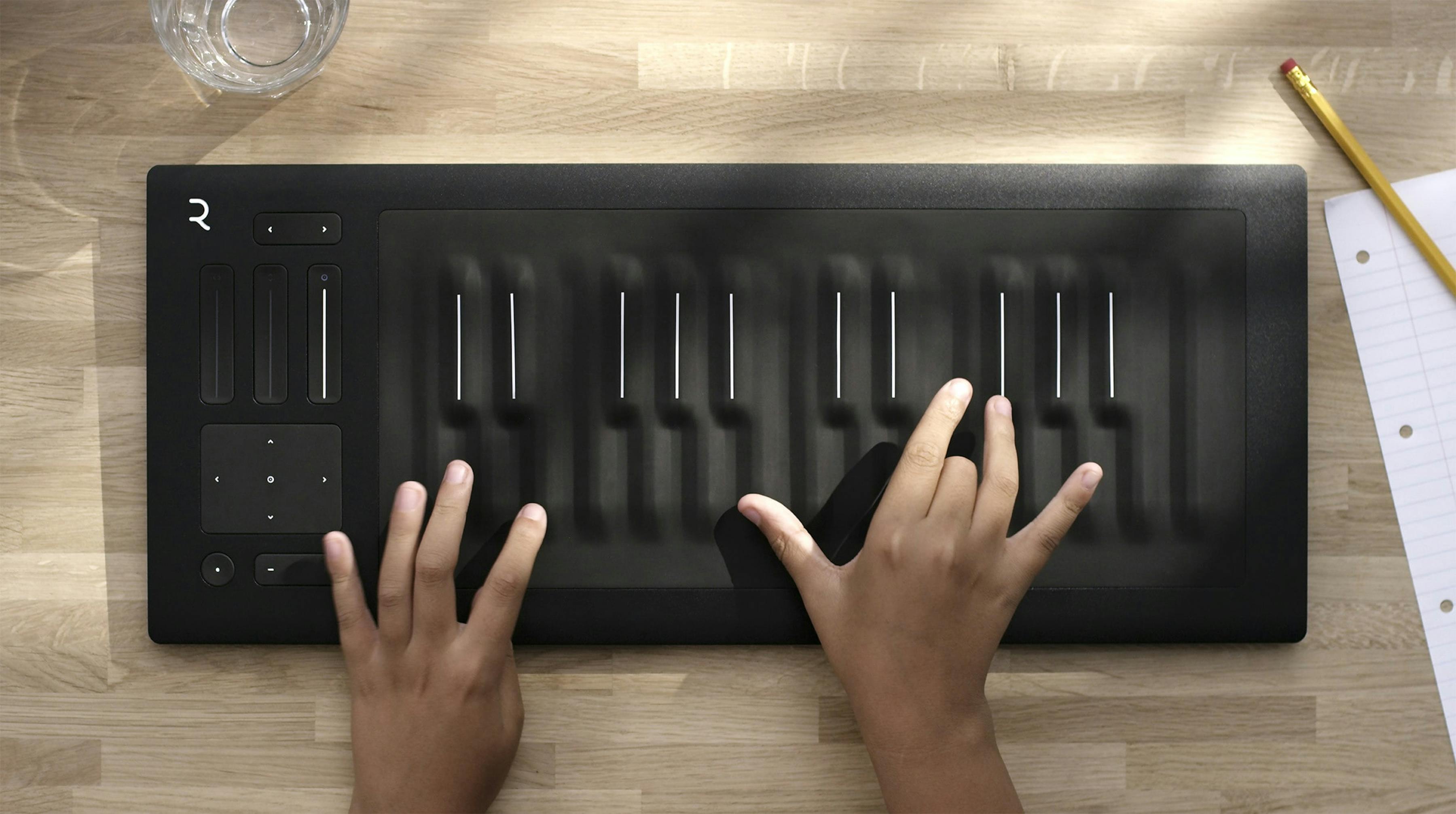 Hands playing Roli keyboard
