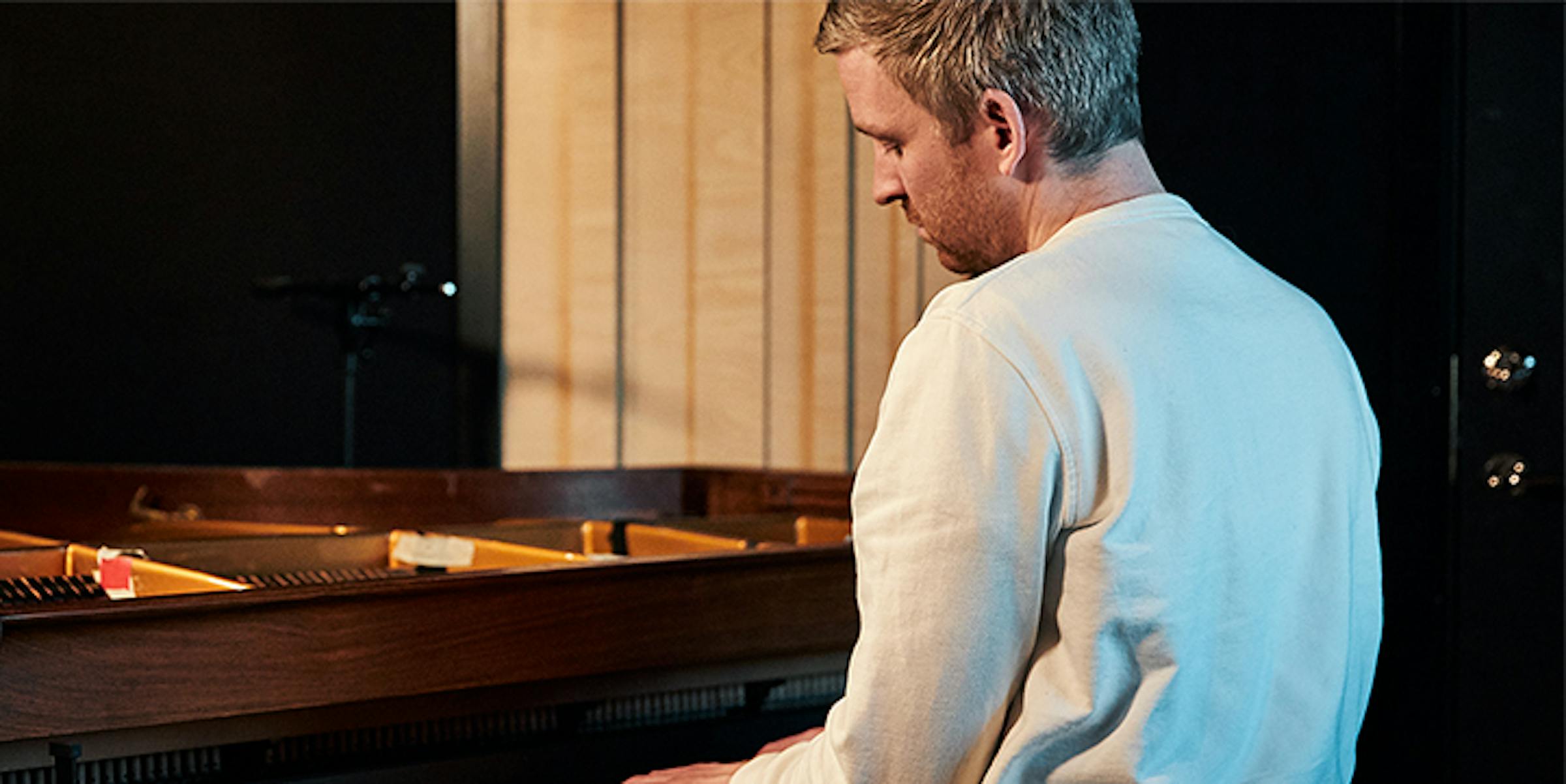 Olafur Arnalds at a grand piano