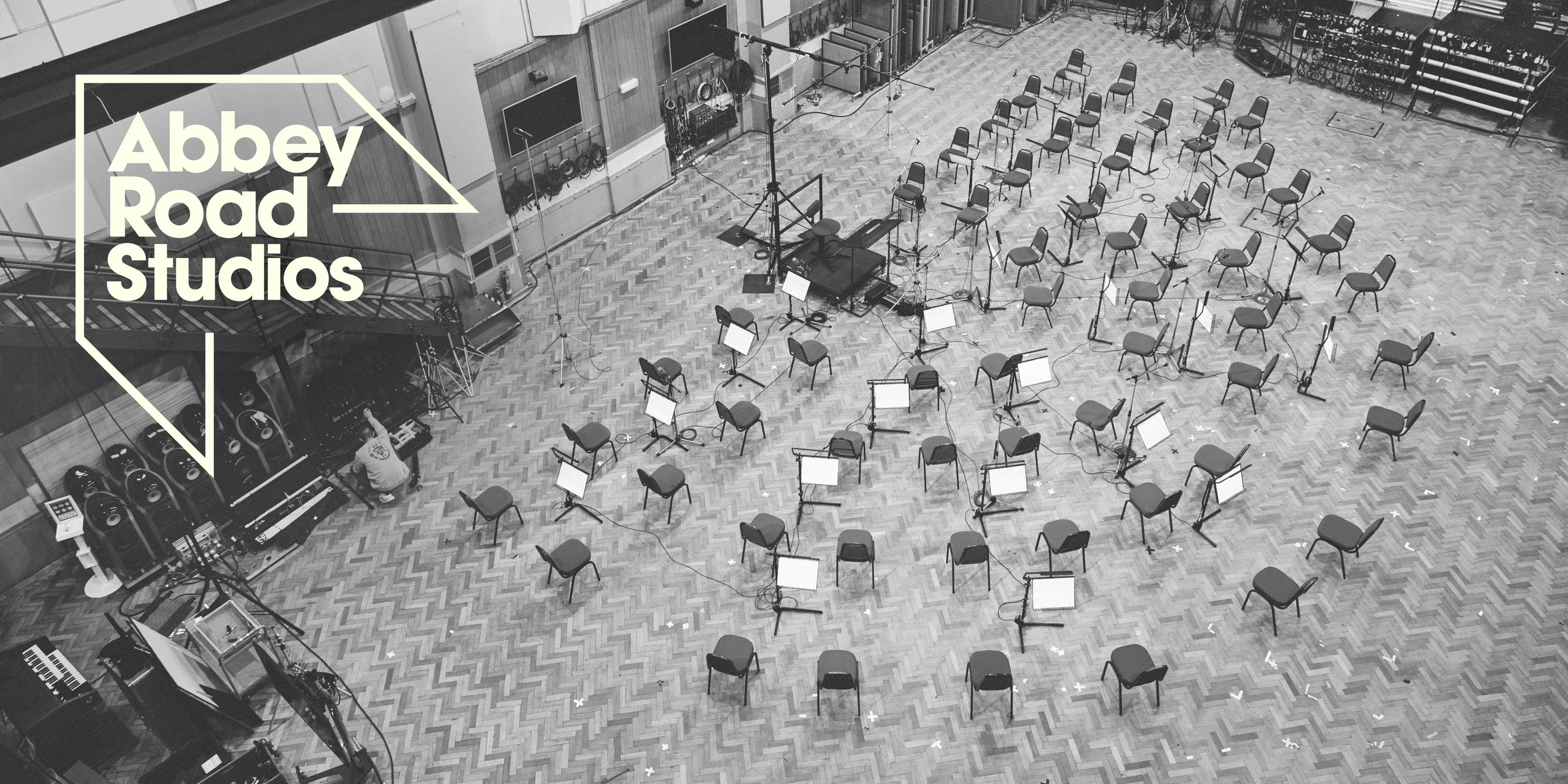 Inside Abbey Road Studios. Overhead view of chairs and microphones set up for an orchestra.