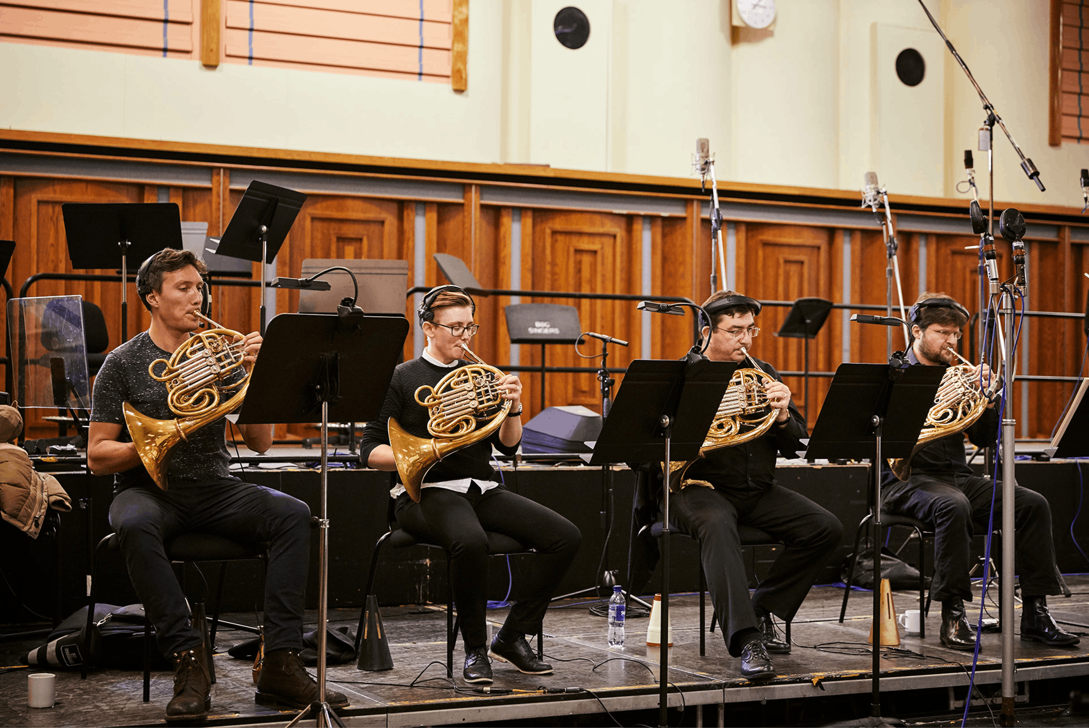 Four french horn players